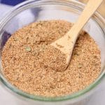 Creole seasoning in a bowl with wood spoon.