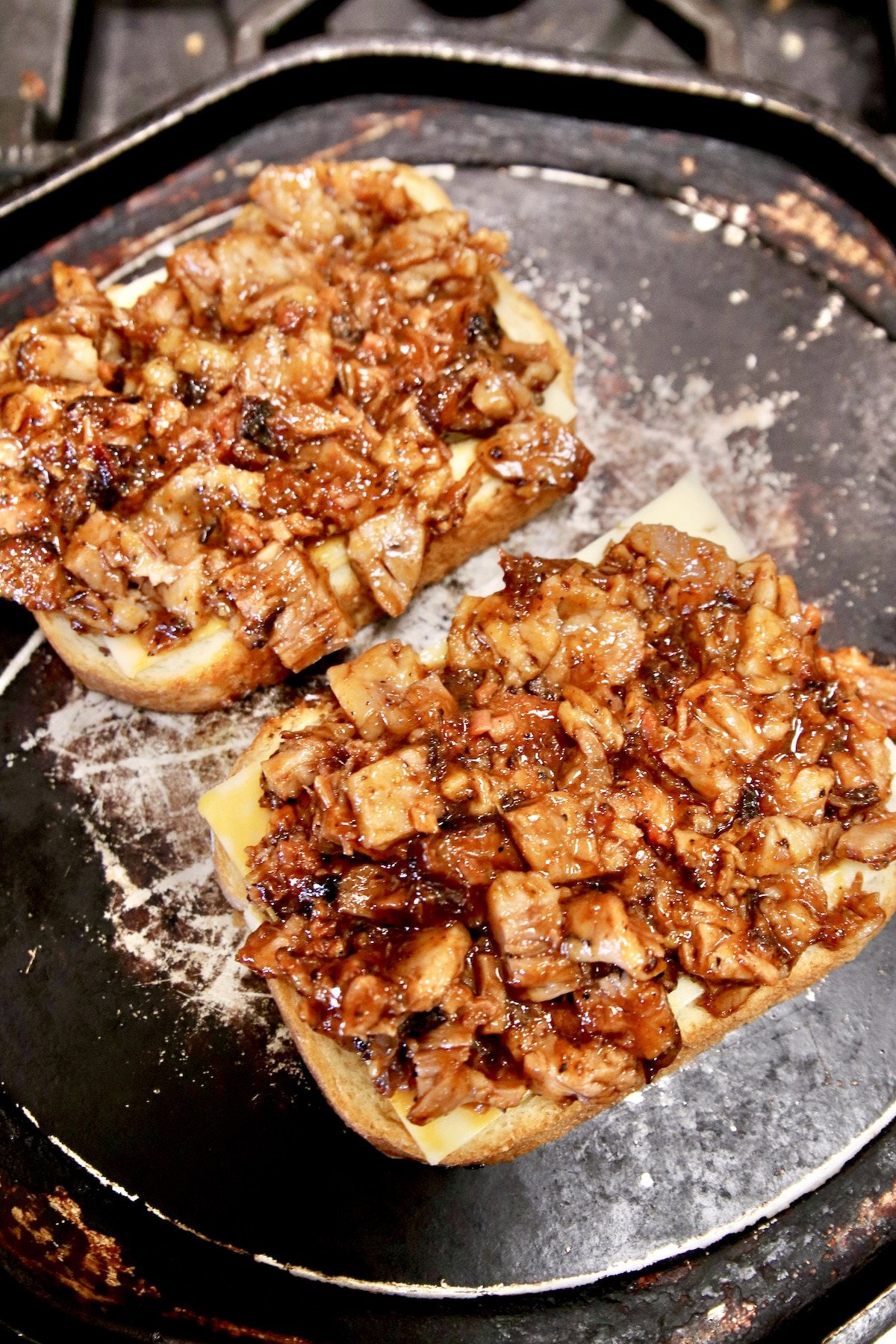 Making grilled cheese with bbq brisket.