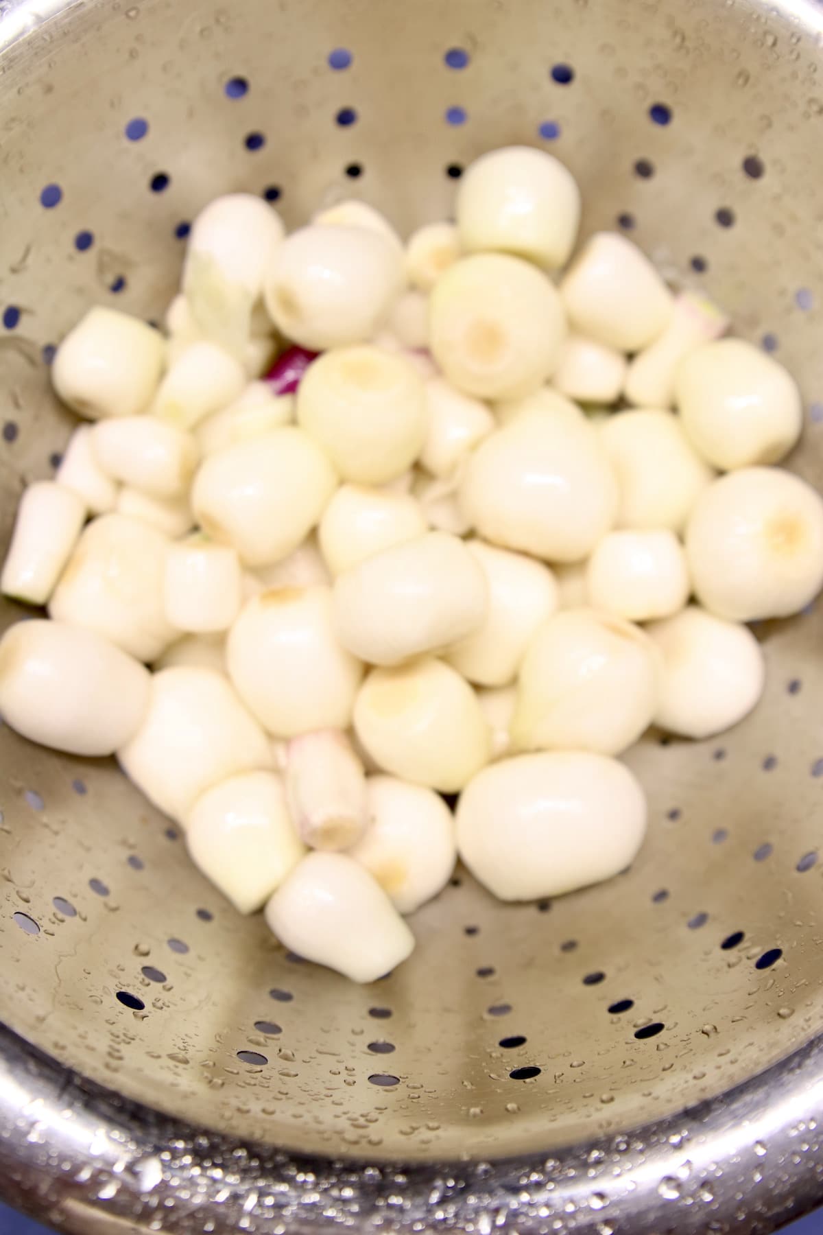 Onions in a colander.