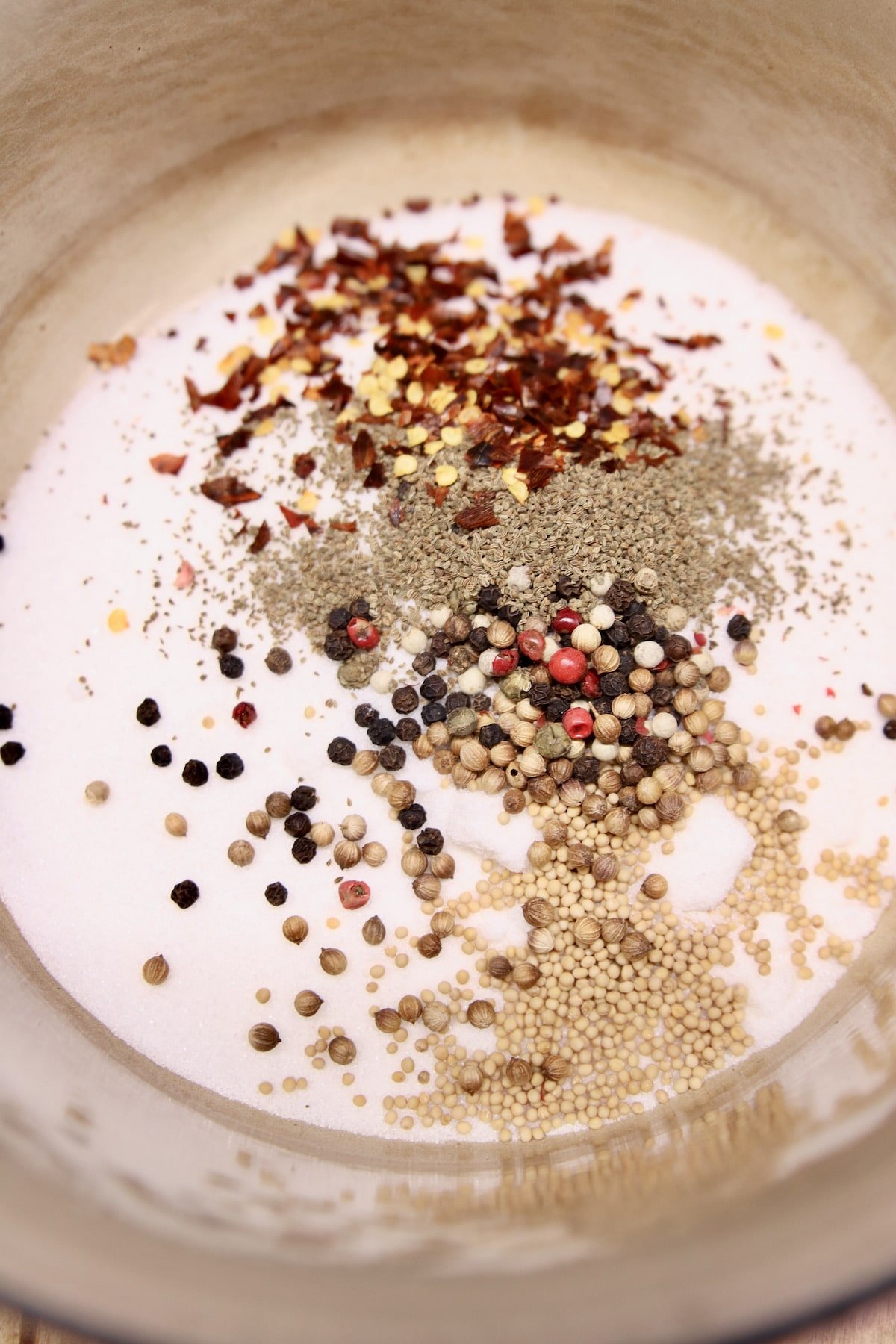 Sugar and pickling spices in a pan.
