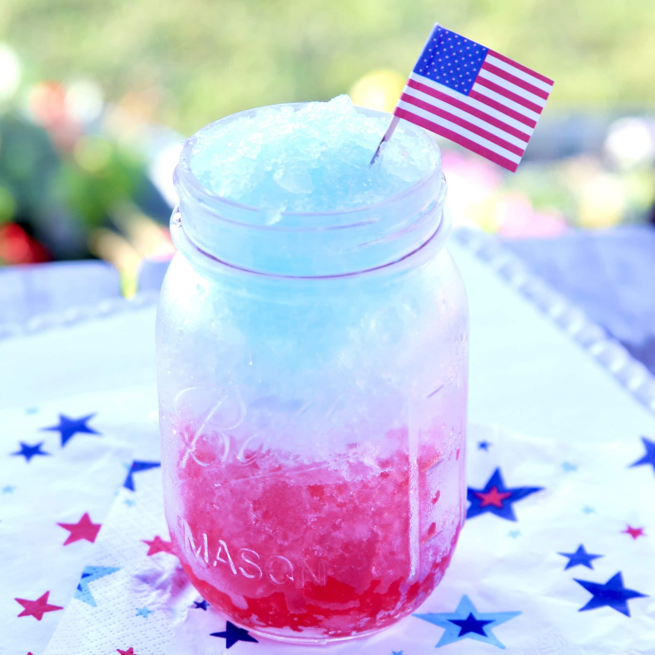 Red white and blue slush in a mason jar.