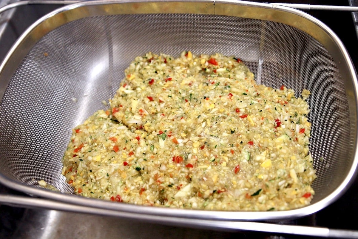 Fine mesh colander with ground vegetables for relish.