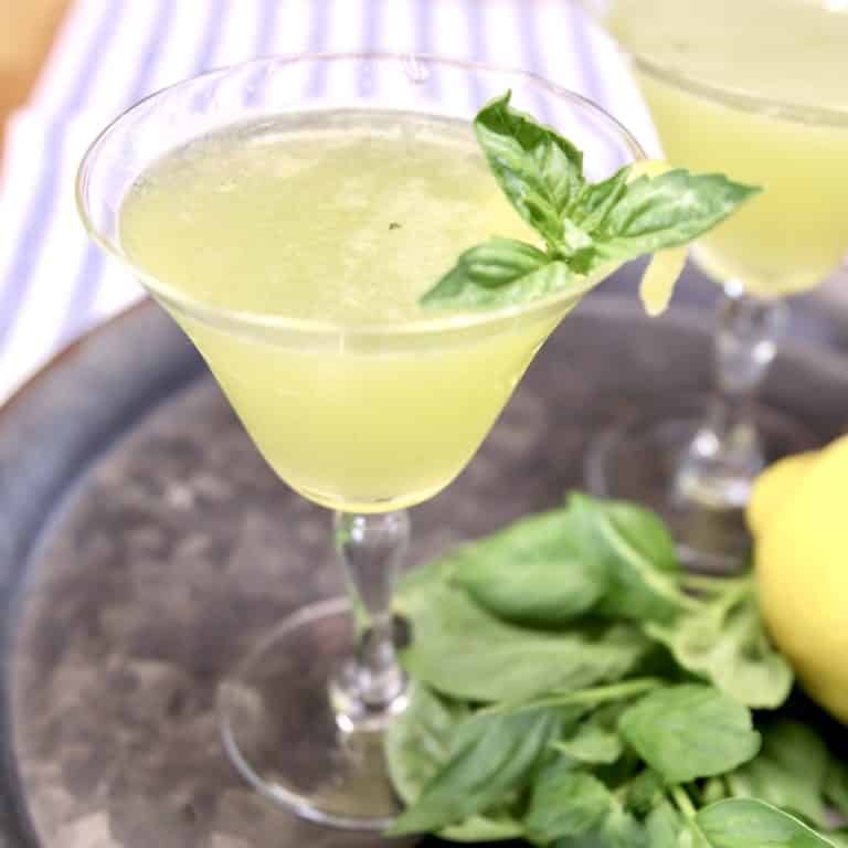 Basil Gin Smash with basil garnish in a coupe glass.