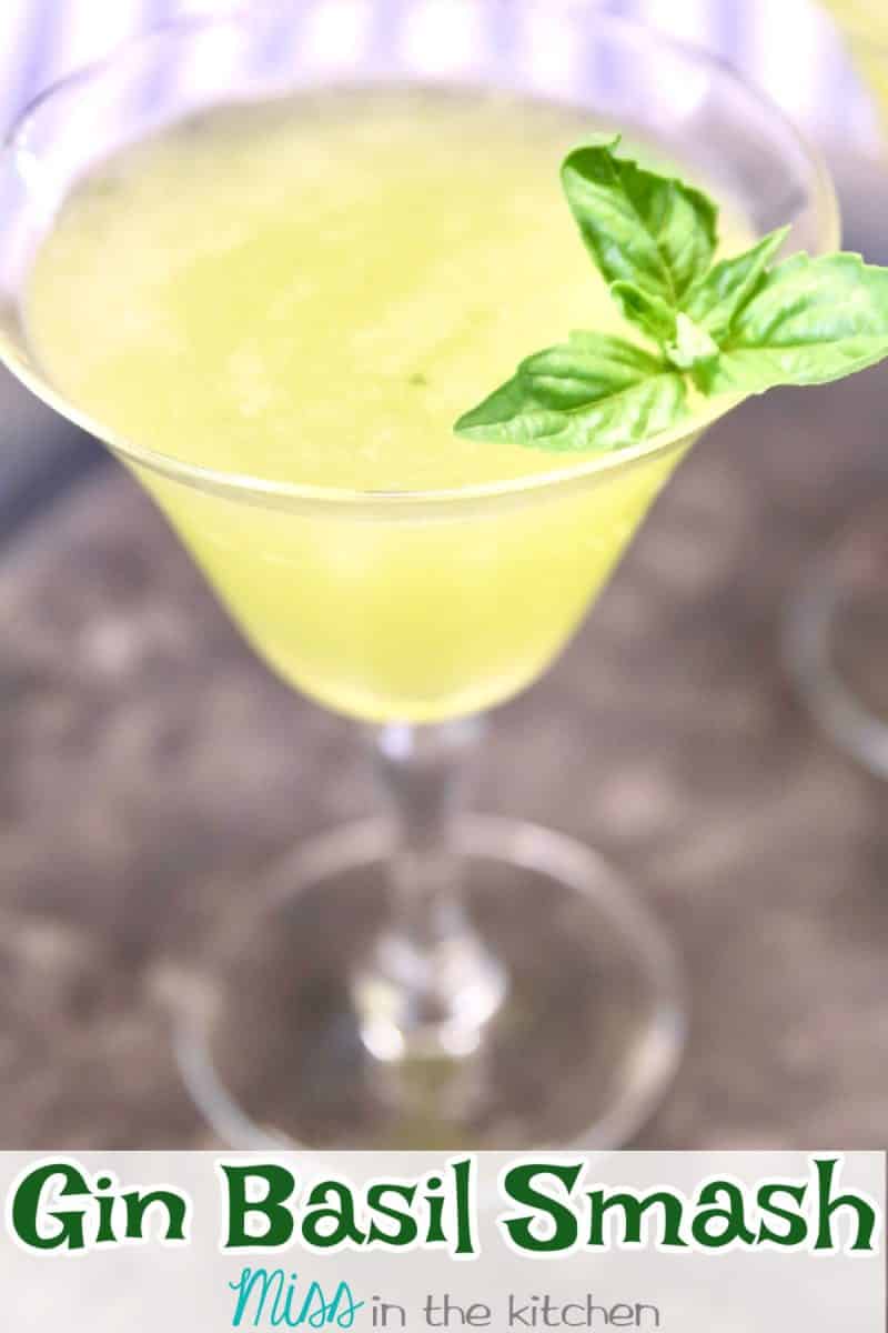 Gin Basil Smash in a coupe glass with text overlay.