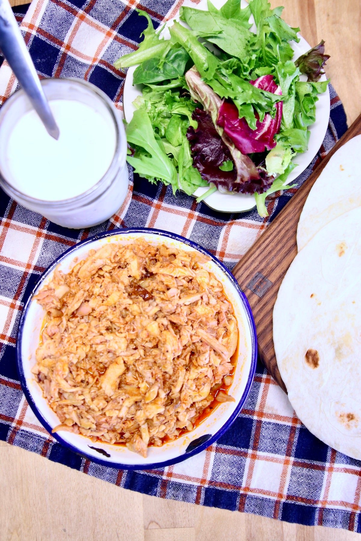 Shredded chicken, lettuce, ranch dressing, flour tortillas.