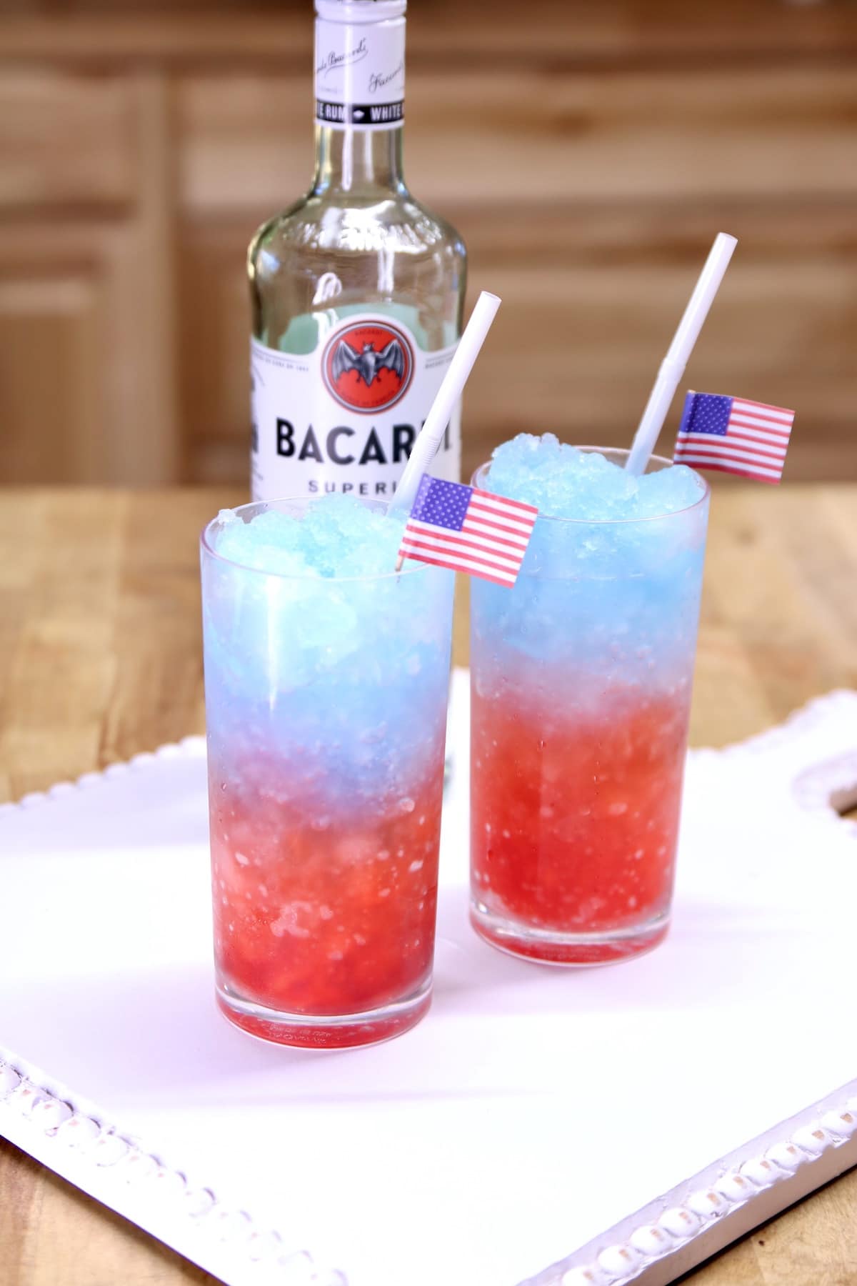 Rum slush cocktails with rum bottle.