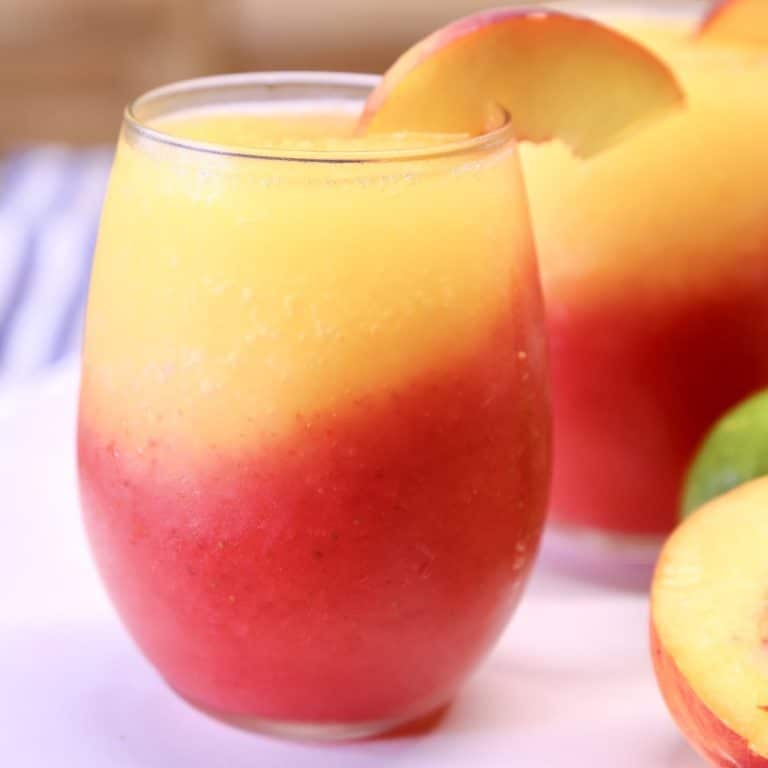 Strawberry Peach Daiquiri layered cocktails.