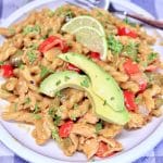 Chicken Fajita Pasta with sliced avocado.