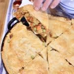 Brisket pot pie, removing one slice.