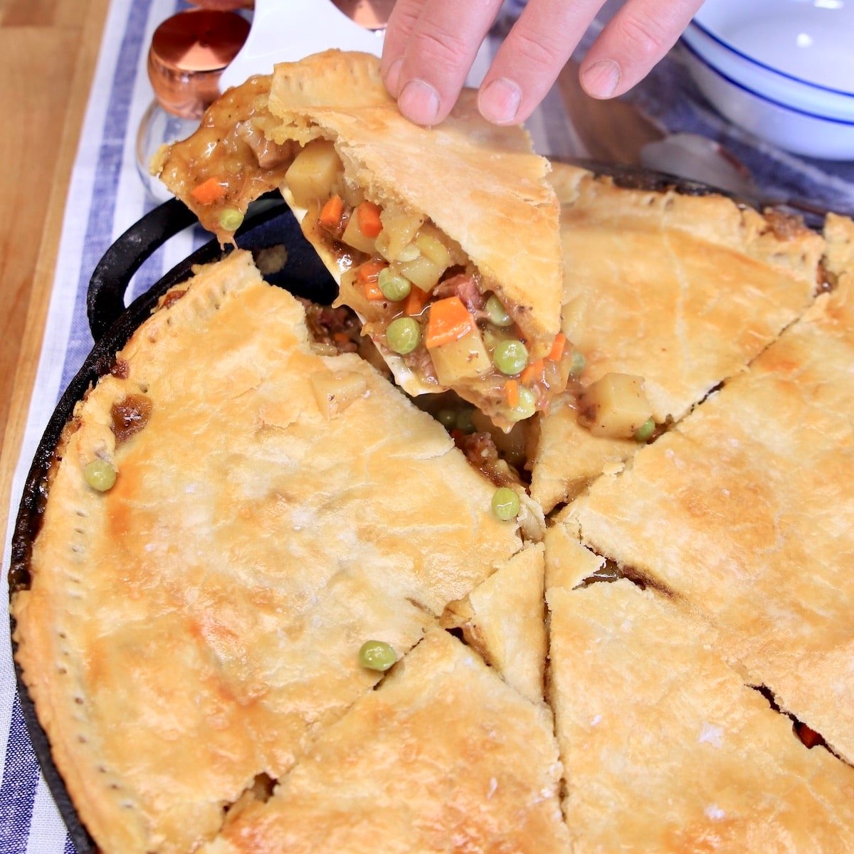 Brisket pot pie, removing one slice.