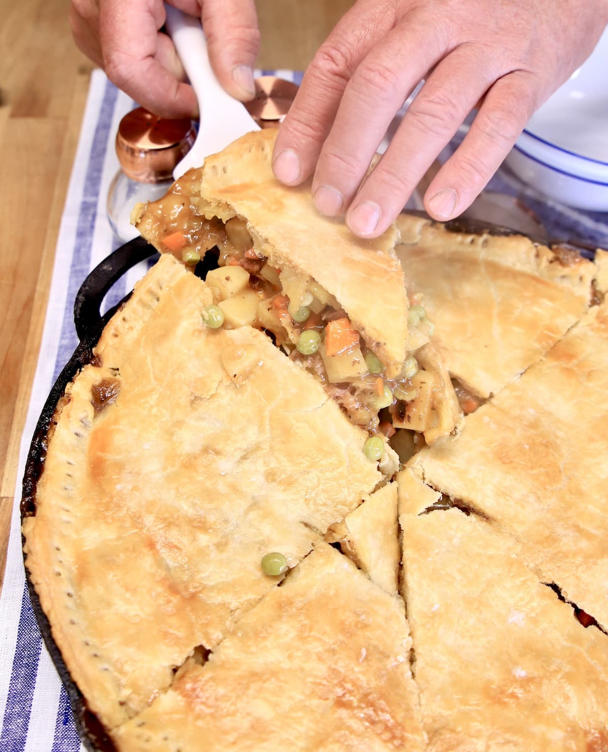 Serving brisket pot pie. 