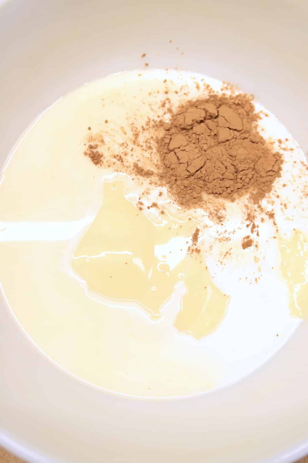 Bowl with milk, sweetened condensed milk, vanilla, cinnamon.