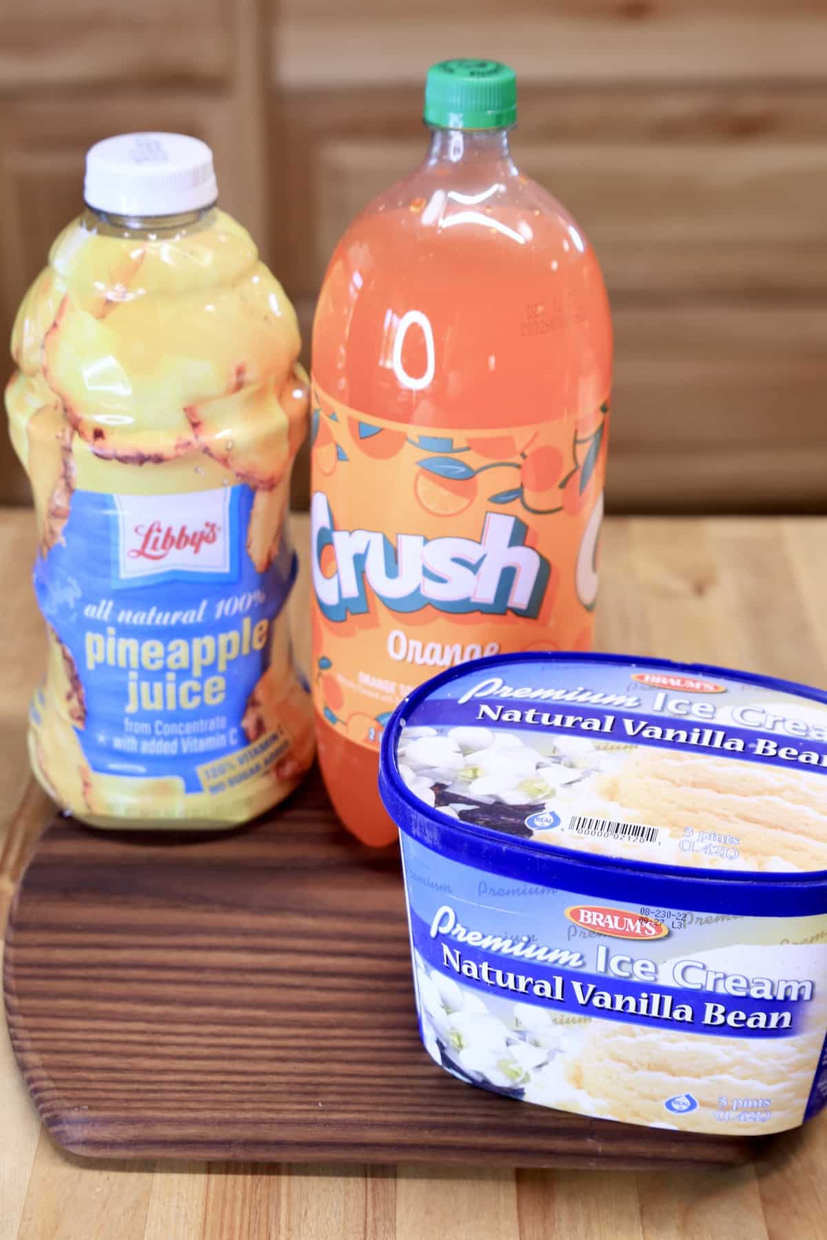 Pineapple juice, orange soda and carton of vanilla ice cream.