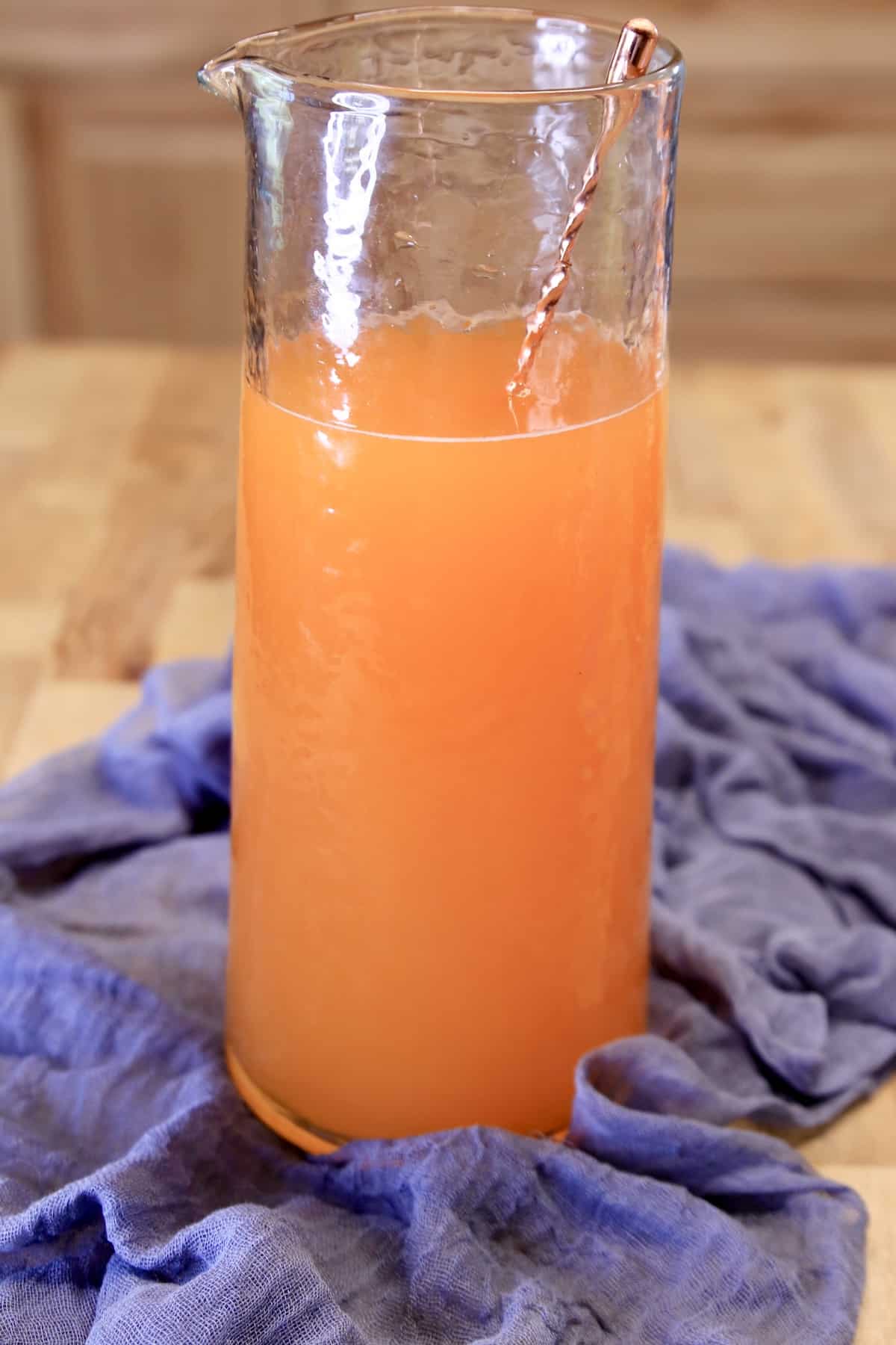 Pitcher of orange party punch.