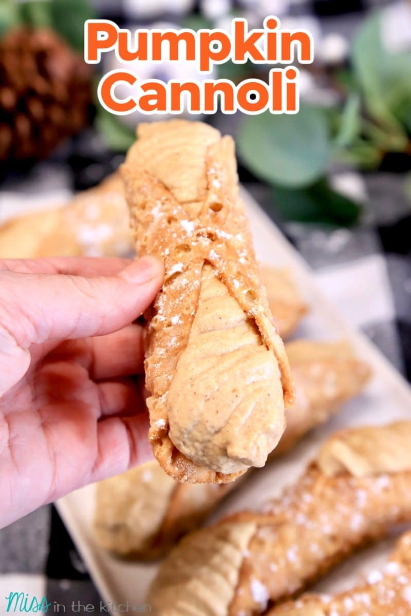 Pumpkin Cannoli held in hand. Text overlay.