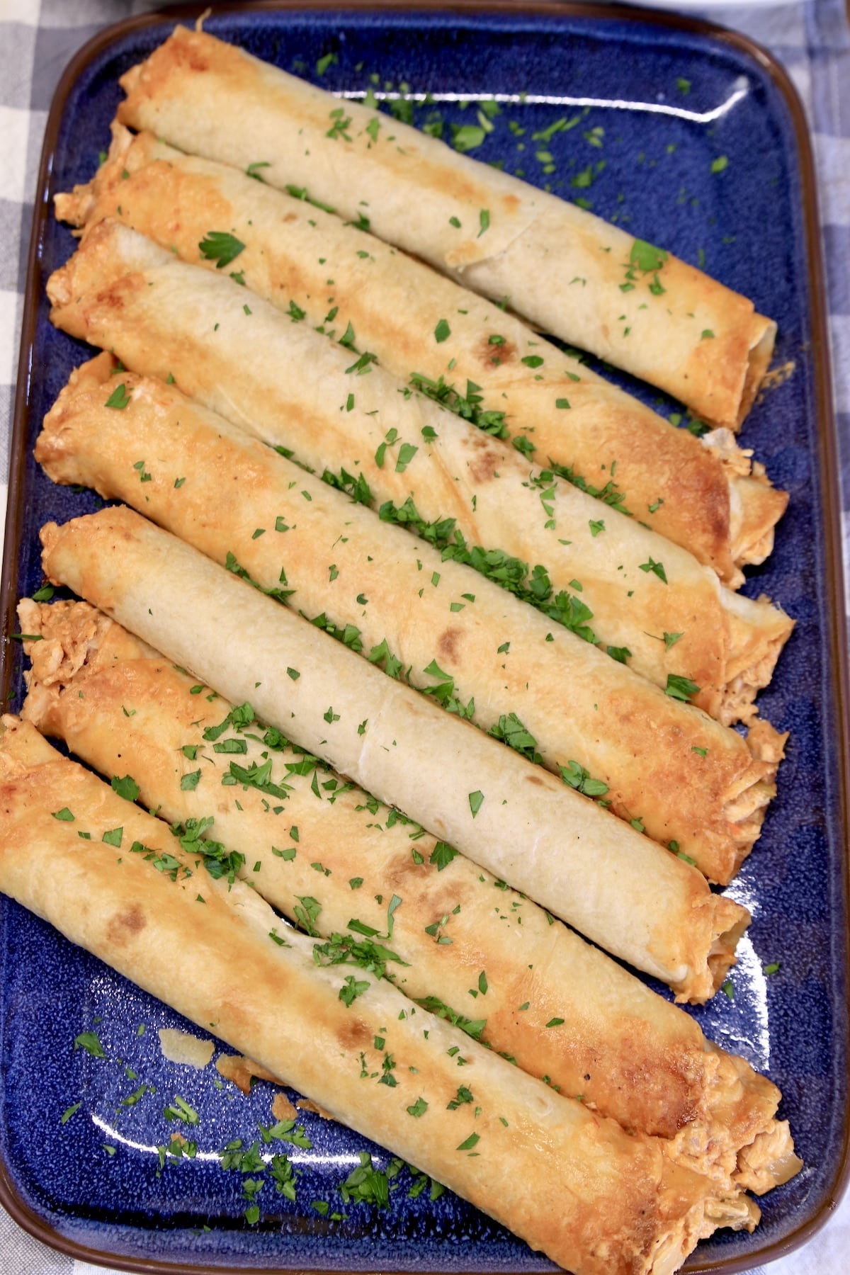 Platter of rolled tacos.