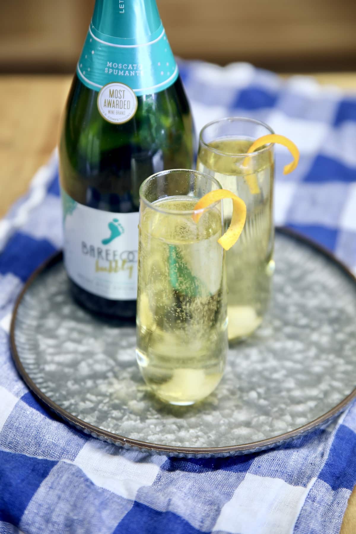 Bottle of champagne and 2 glasses.