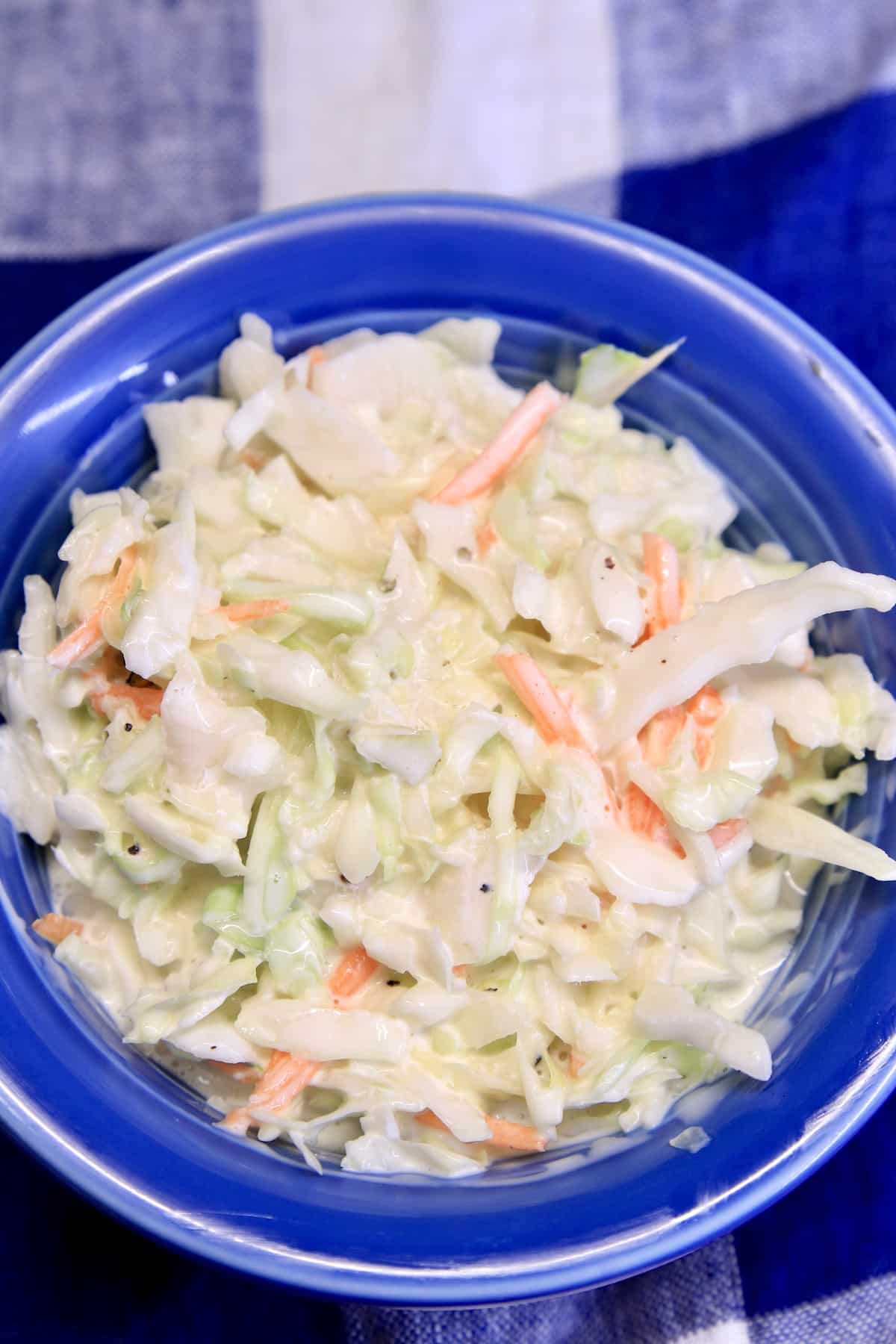 Blue bowl of coleslaw.