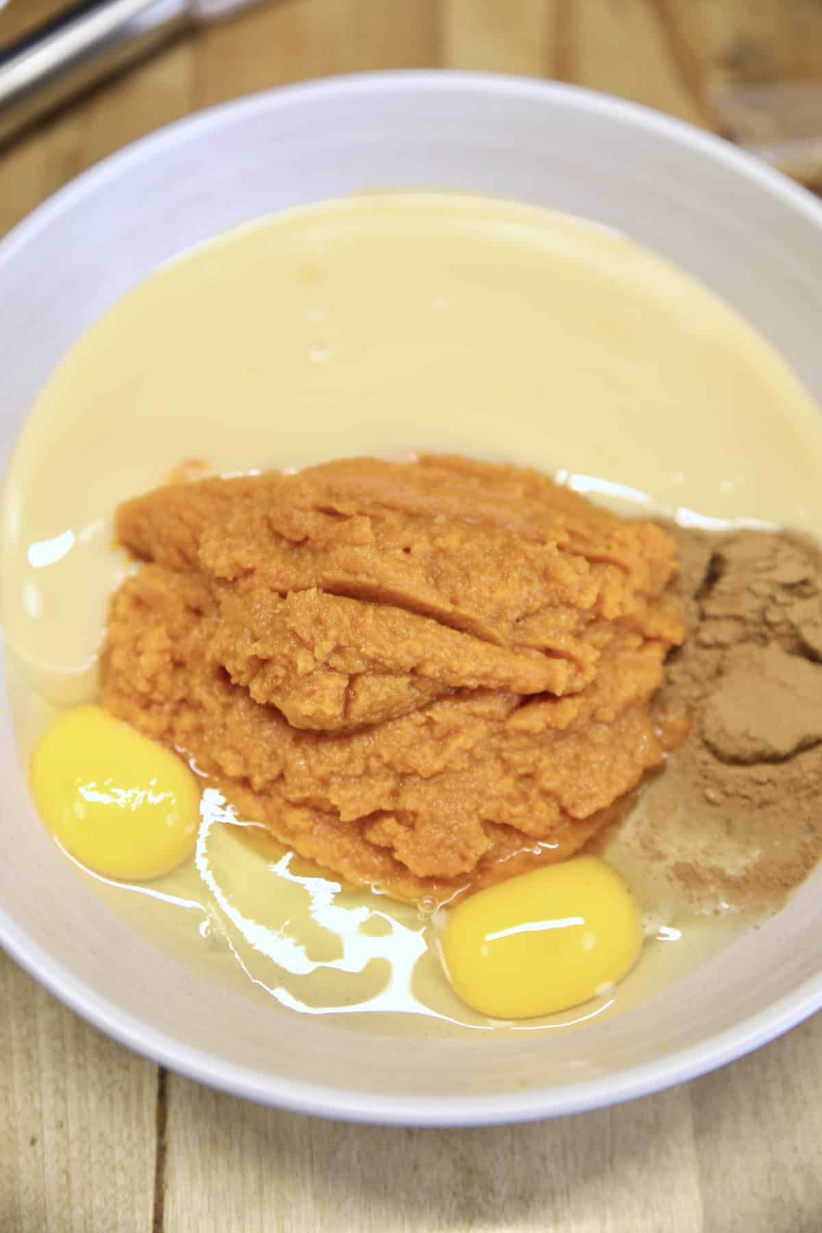 Bowl with ingredients for pumpkin pie.