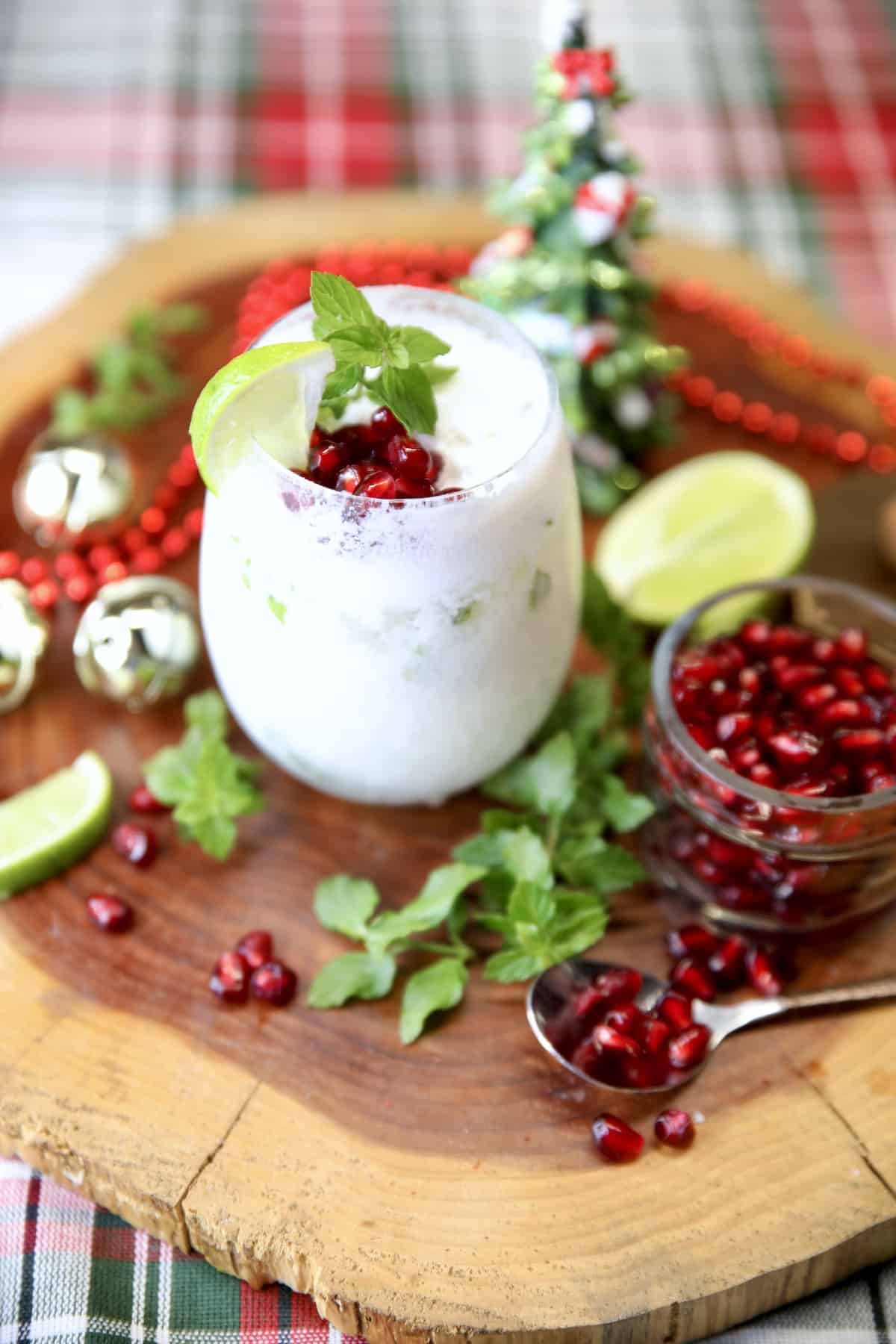 White Christmas Mojito on a board with Christmas decor.