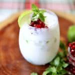 Coconut mojito in a stemless wine glass.