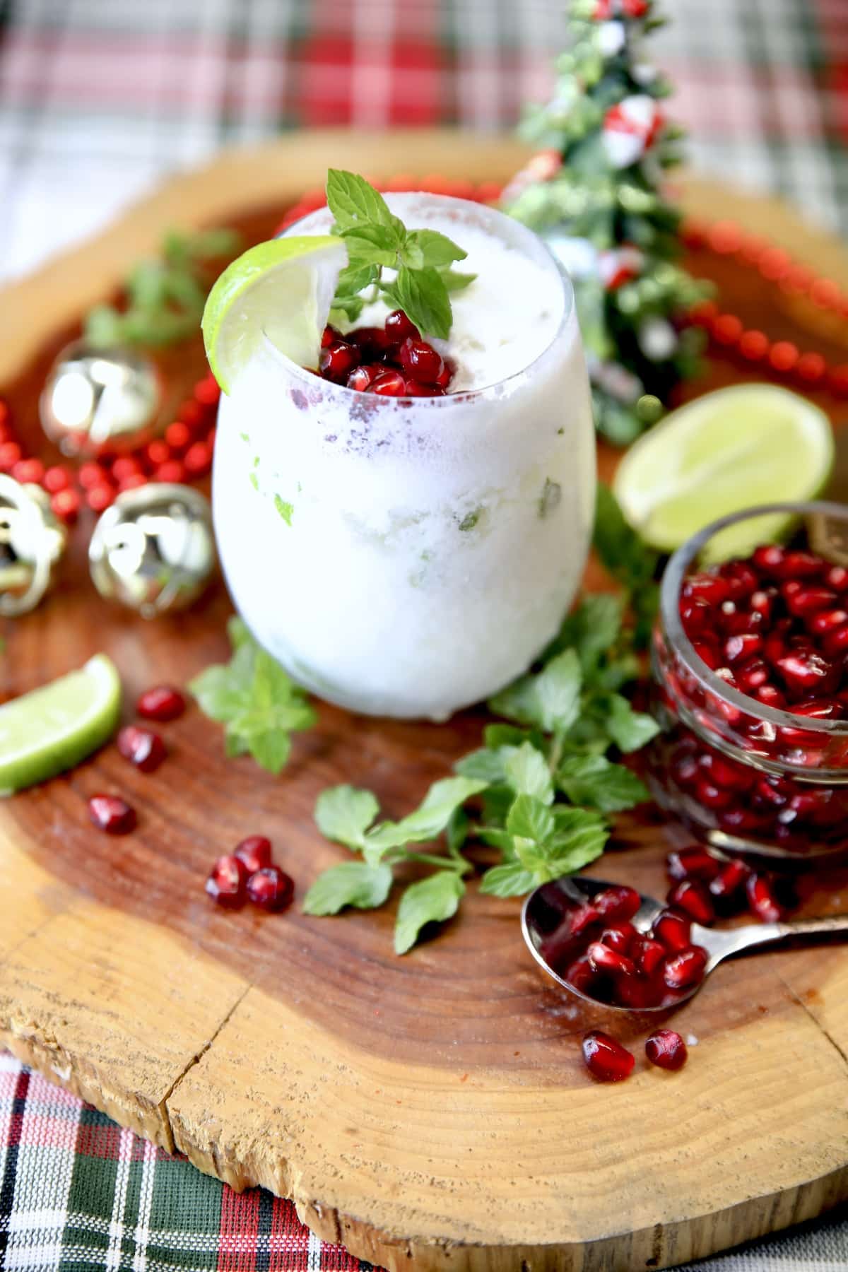 Stemless wine glass with coconut mojito, Christmas decor.