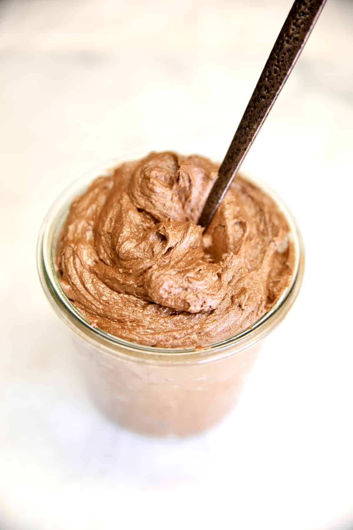 Jar of chocolate frosting.