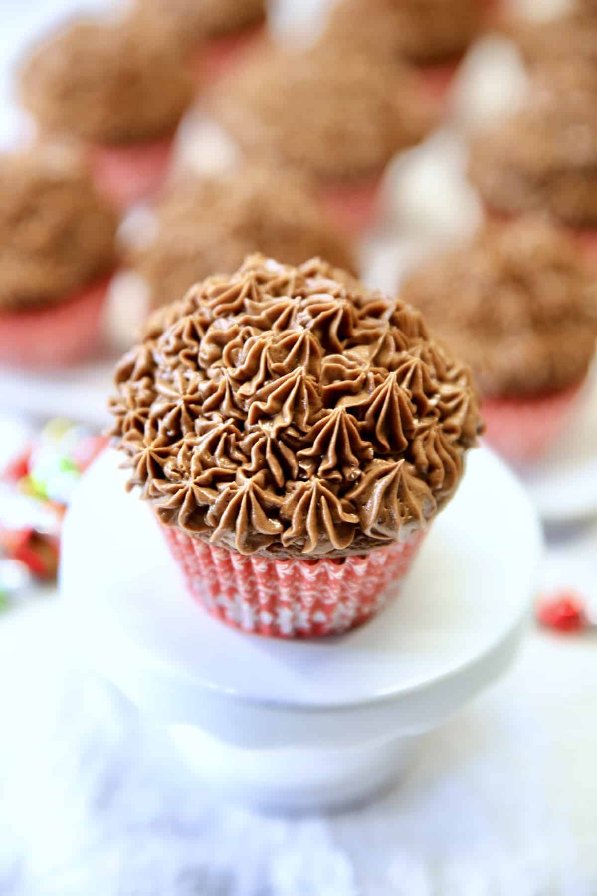 Chocolate cupcake on a pedestal.