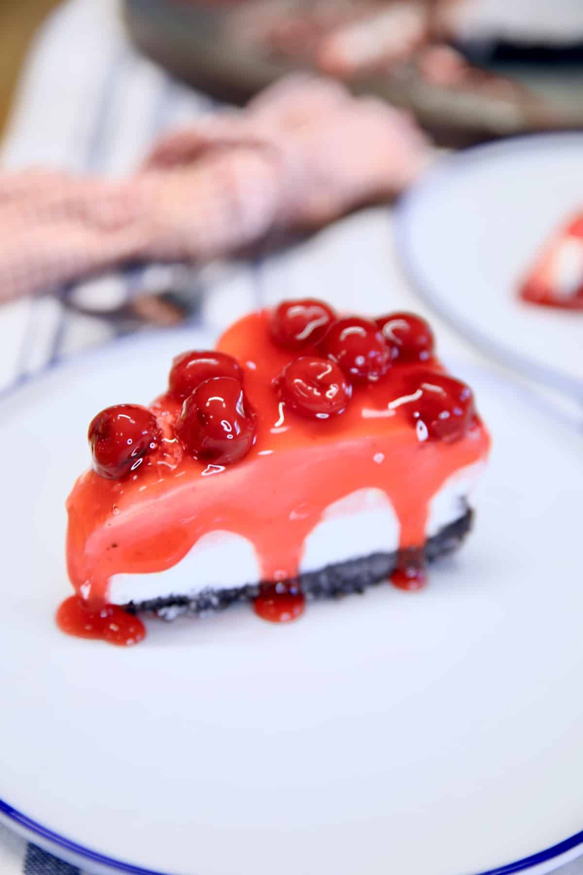 Cherry cheesecake on a plate.