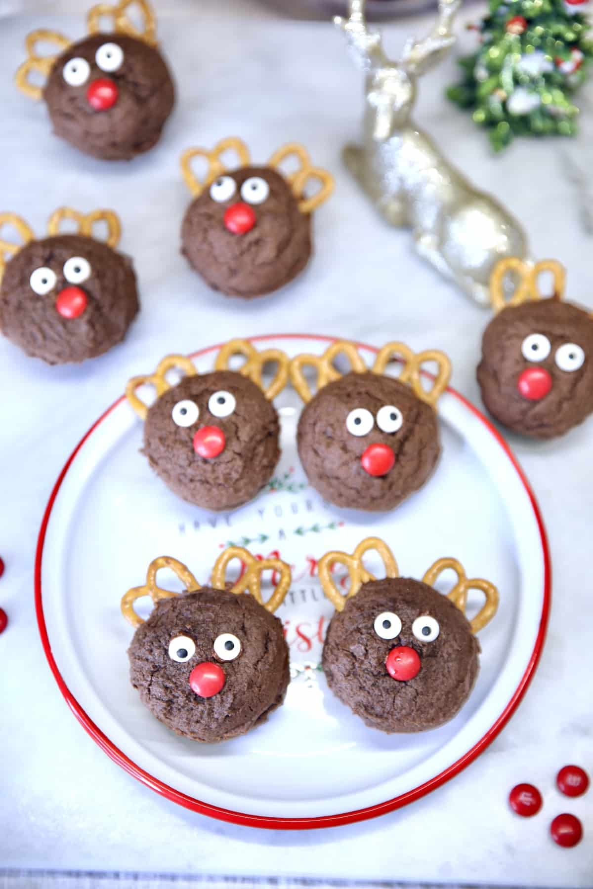 Overhead view of Reindeer Cookies, on a plate, and on marble board.
