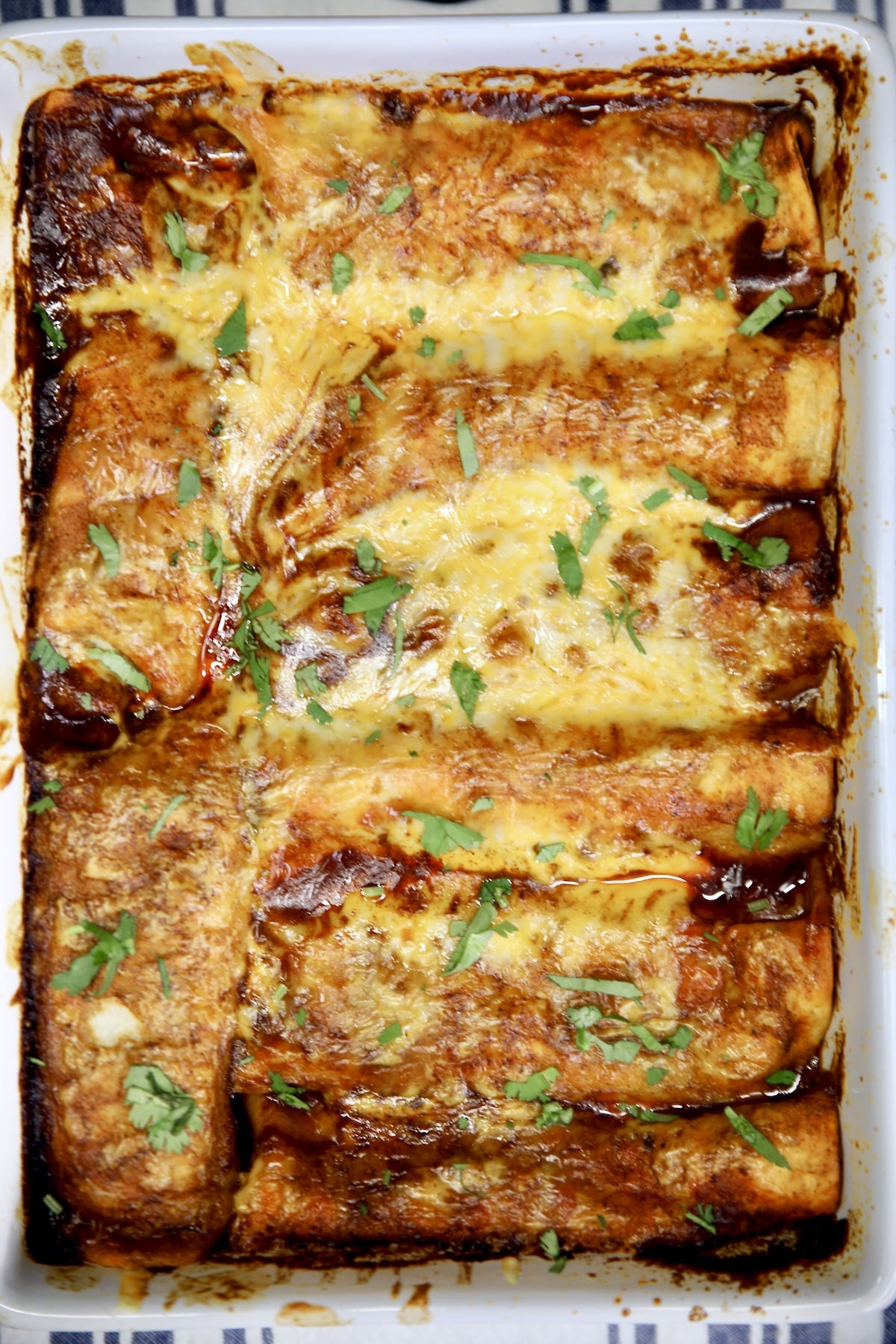 Casserole dish with brisket enchiladas.