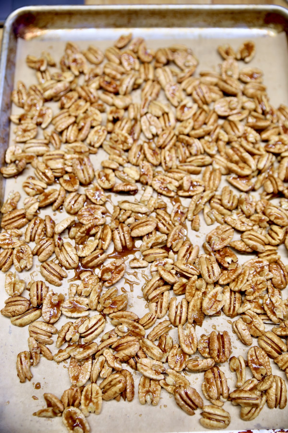 Baking sheet with candied pecans.