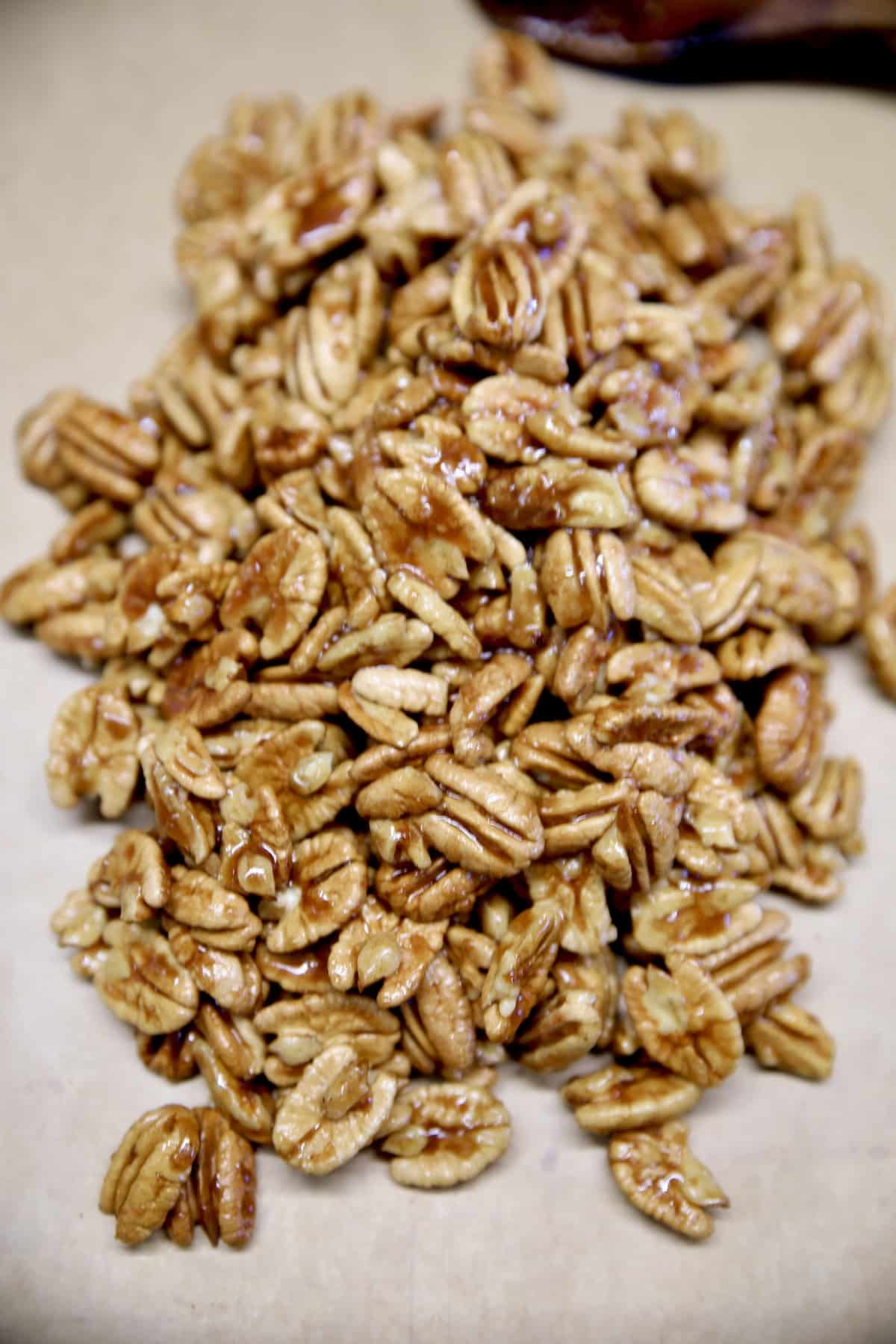 Parchment paper with candied pecans.