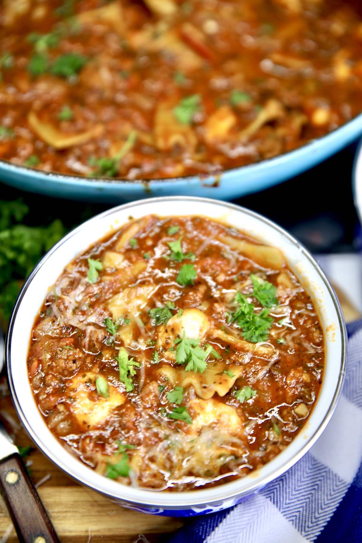 Lasagna Soup is a quick soup recipe loaded with your favorite Italian flavors. Made with ground beef and pasta in a tomato broth with Italian seasonings and loaded with cheese. Bowl of lasagna soup.