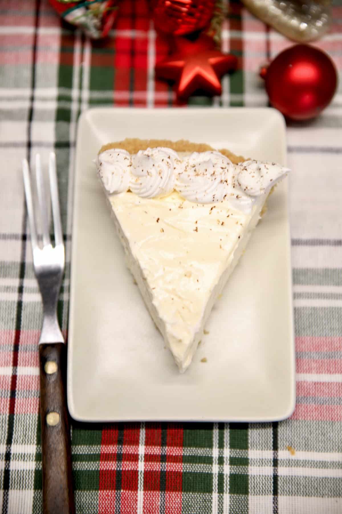 Slice of eggnog cheesecake.