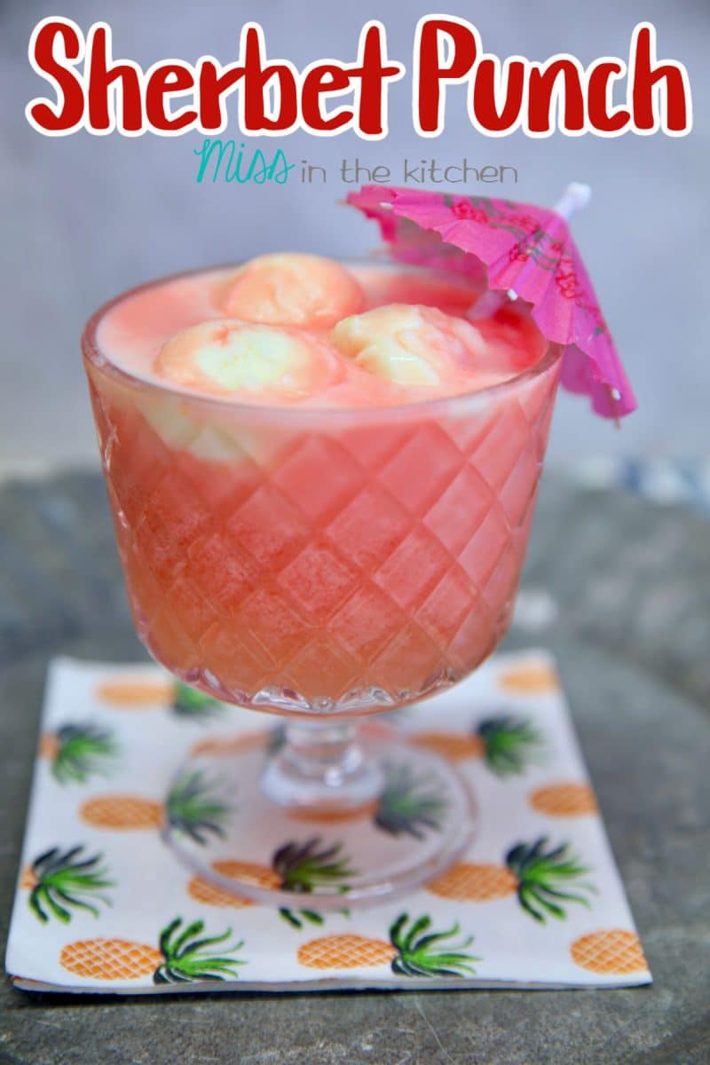 Sherbet Punch in a glass with drink umbrella. Text overlay.