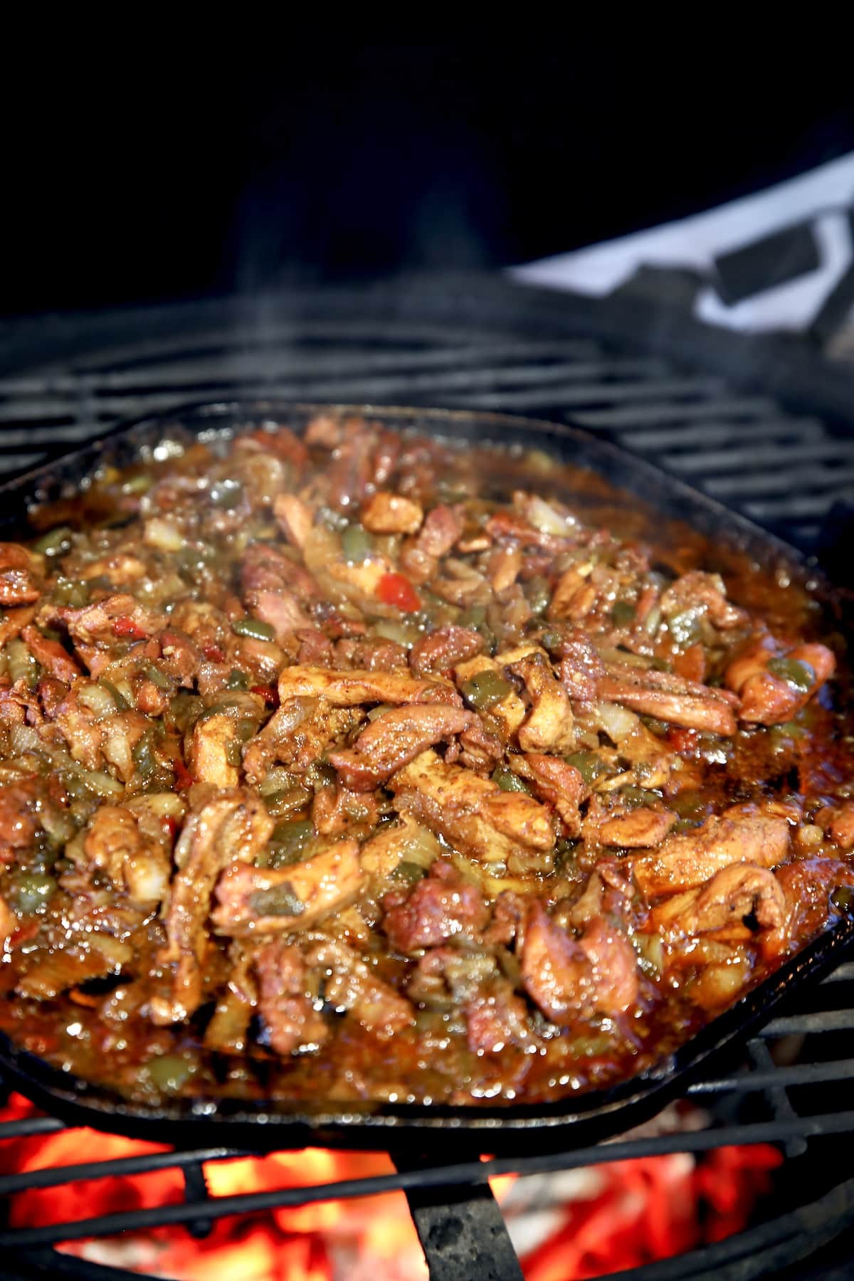 Grilling chicken fajitas on a griddle pan.