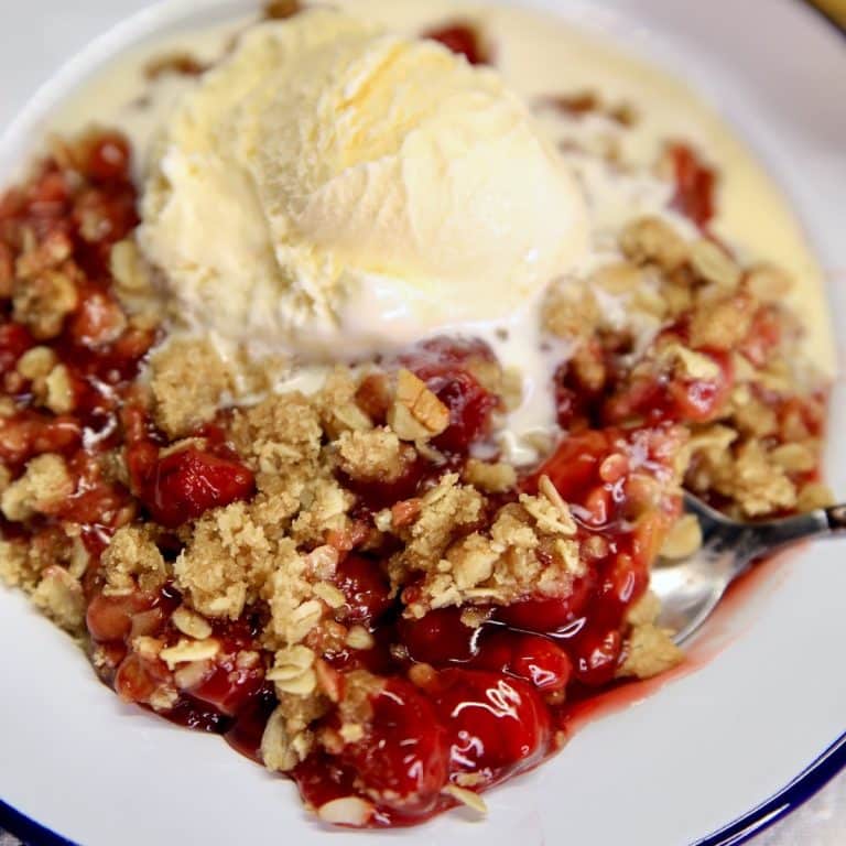 Cherry crisp with vanilla ice cream.