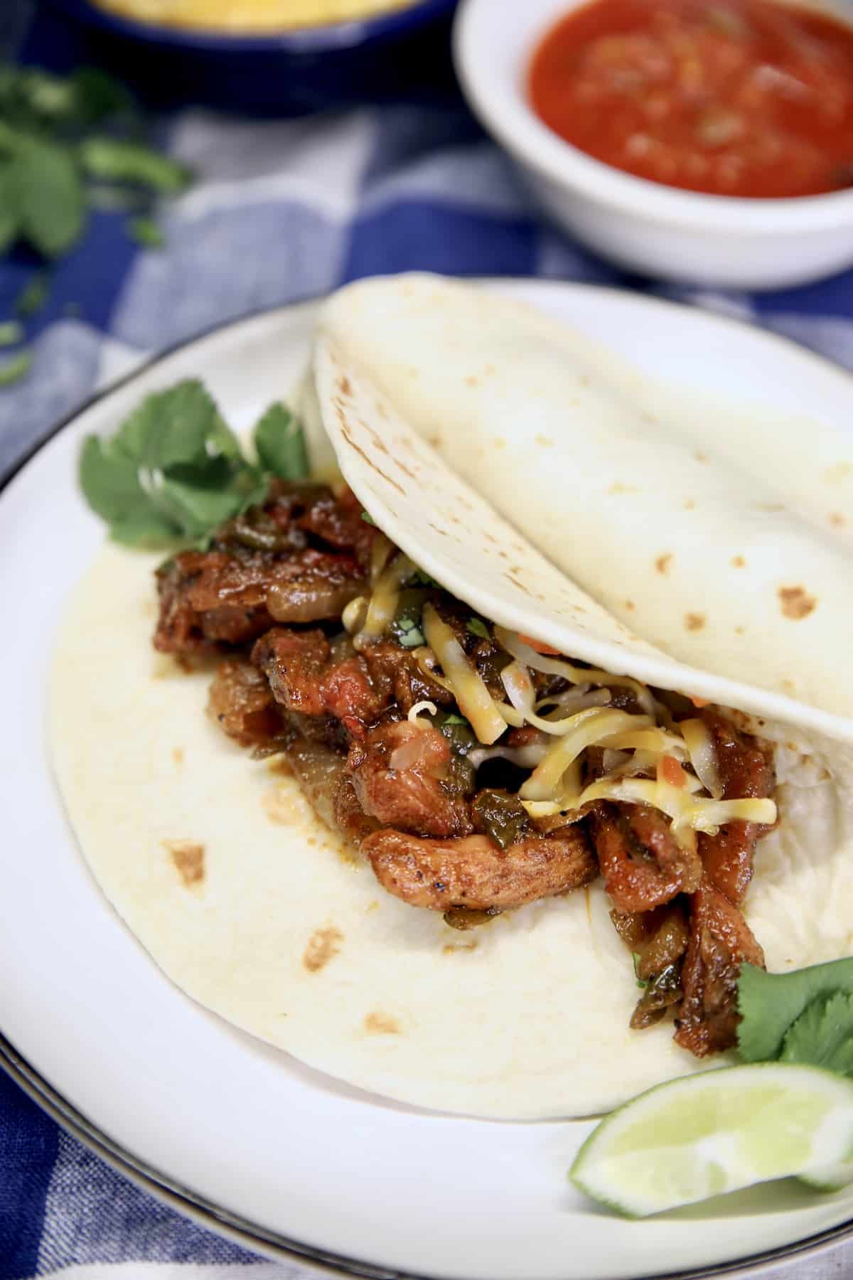 Plate with chicken fajitas.