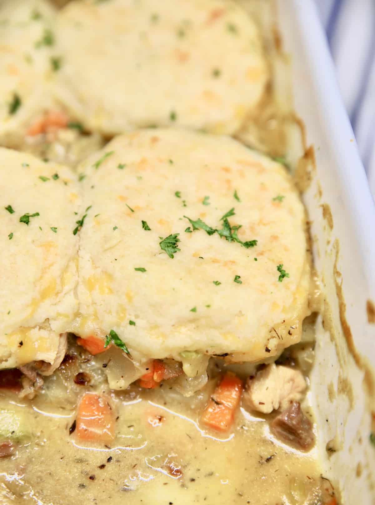 Casserole of chicken and vegetable filling topped with biscuits.