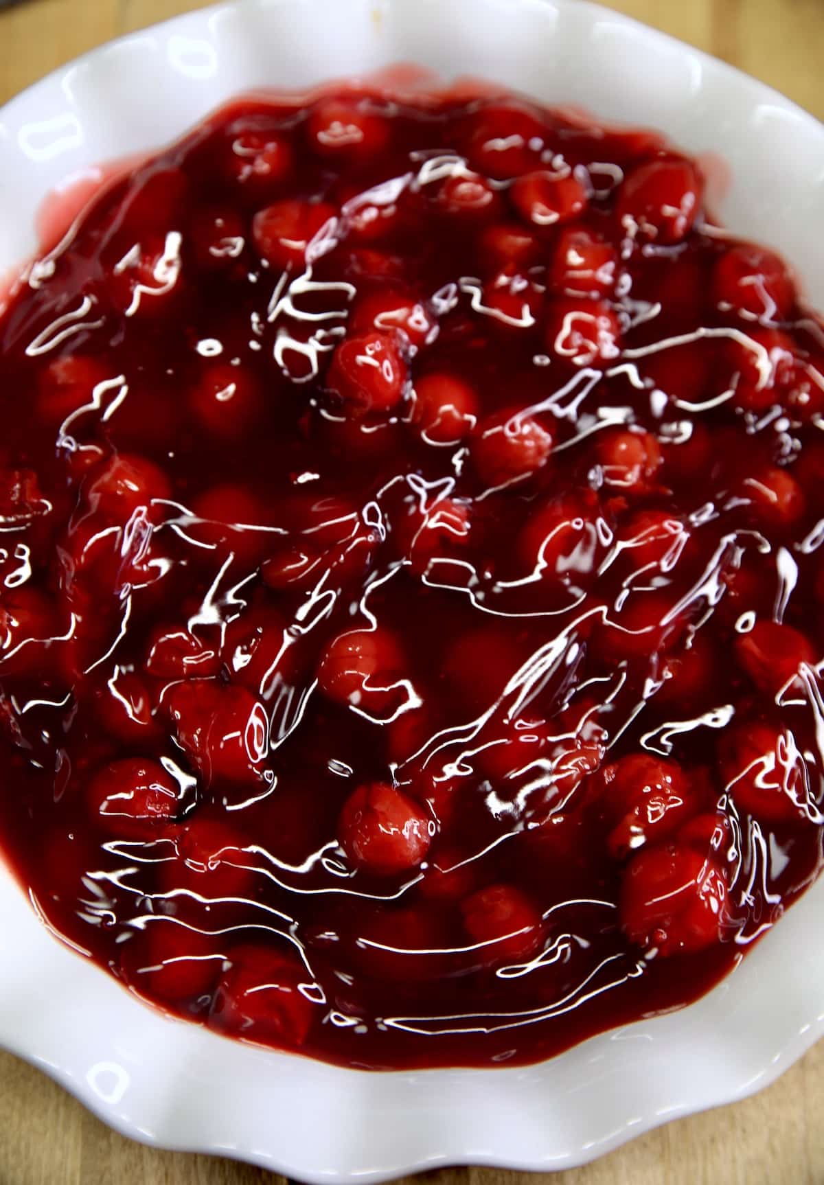 Cherry pie filling in a pie plate.