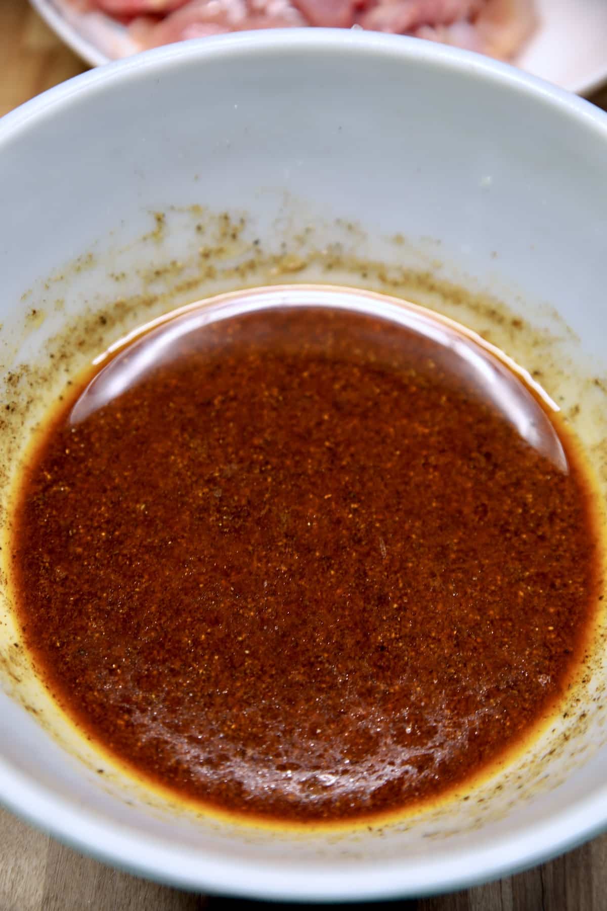 Bowl of chicken fajita marinade.
