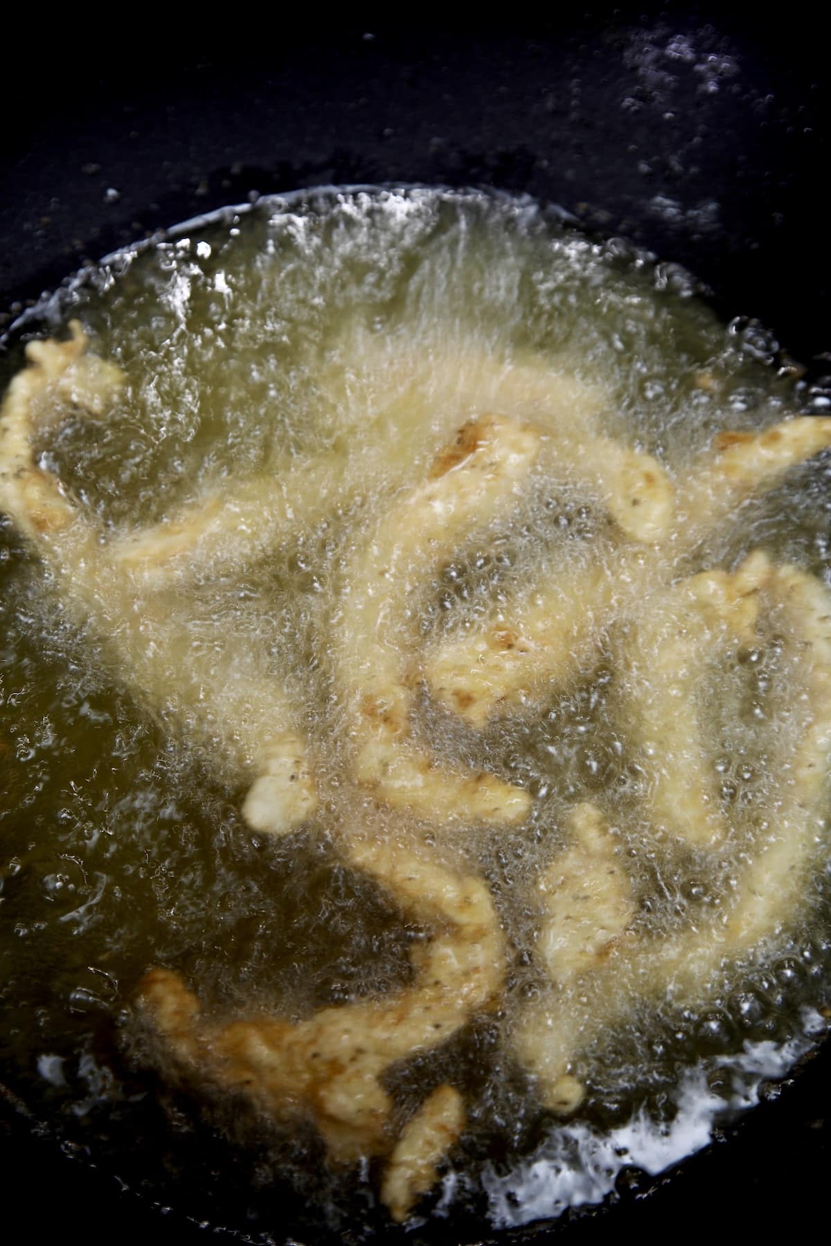Frying chicken fries in vegetable oil.