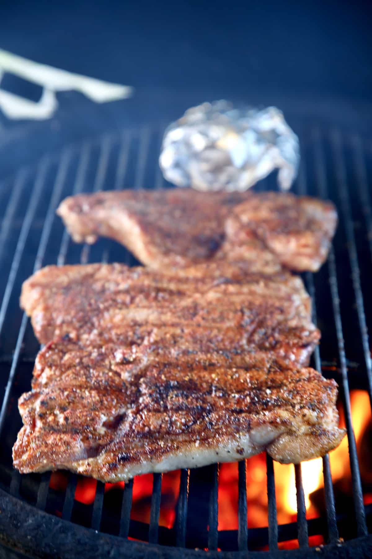 Grilling 3 NY Strip Steaks.