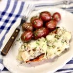 Lobster Thermidor on a plate with baby red potatoes.