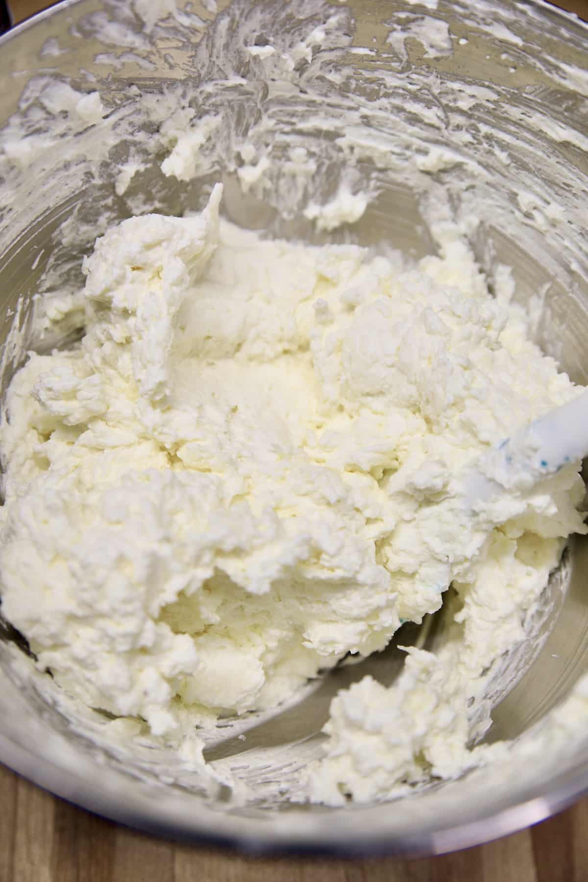 Bowl of coconut cheesecake filling.