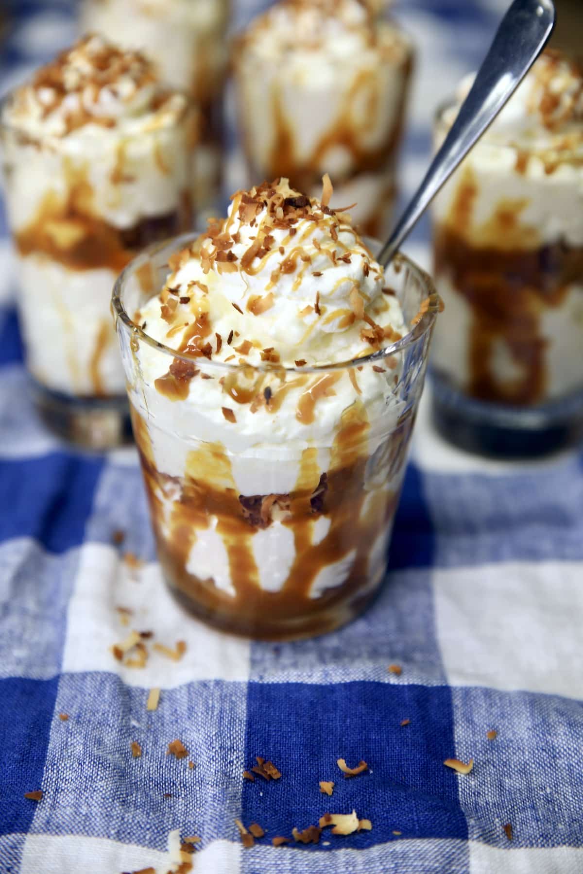 Individual servings of no bake coconut cheesecake.