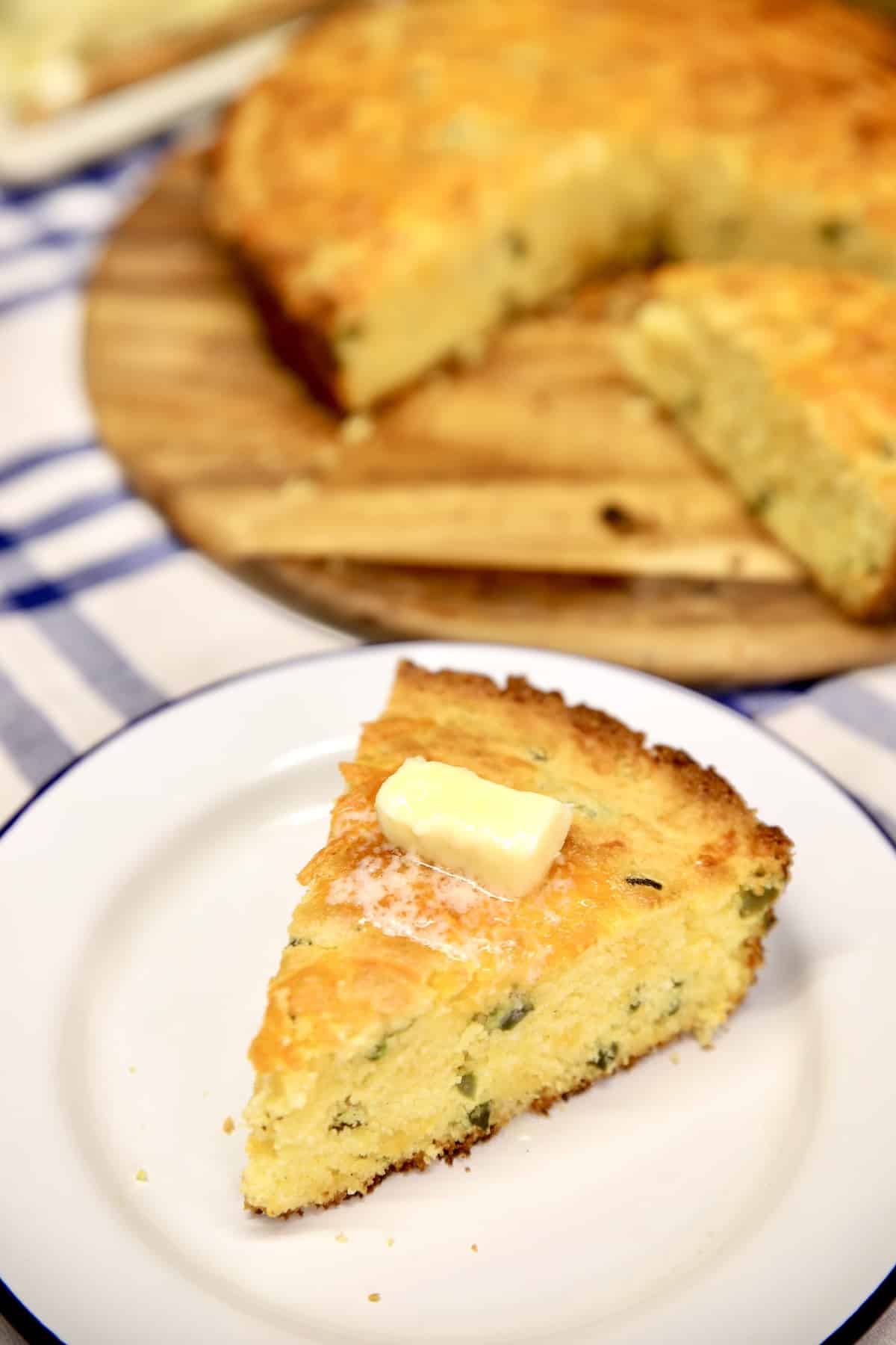 Jalapeño Cheddar Cornbread slice with melting butter.