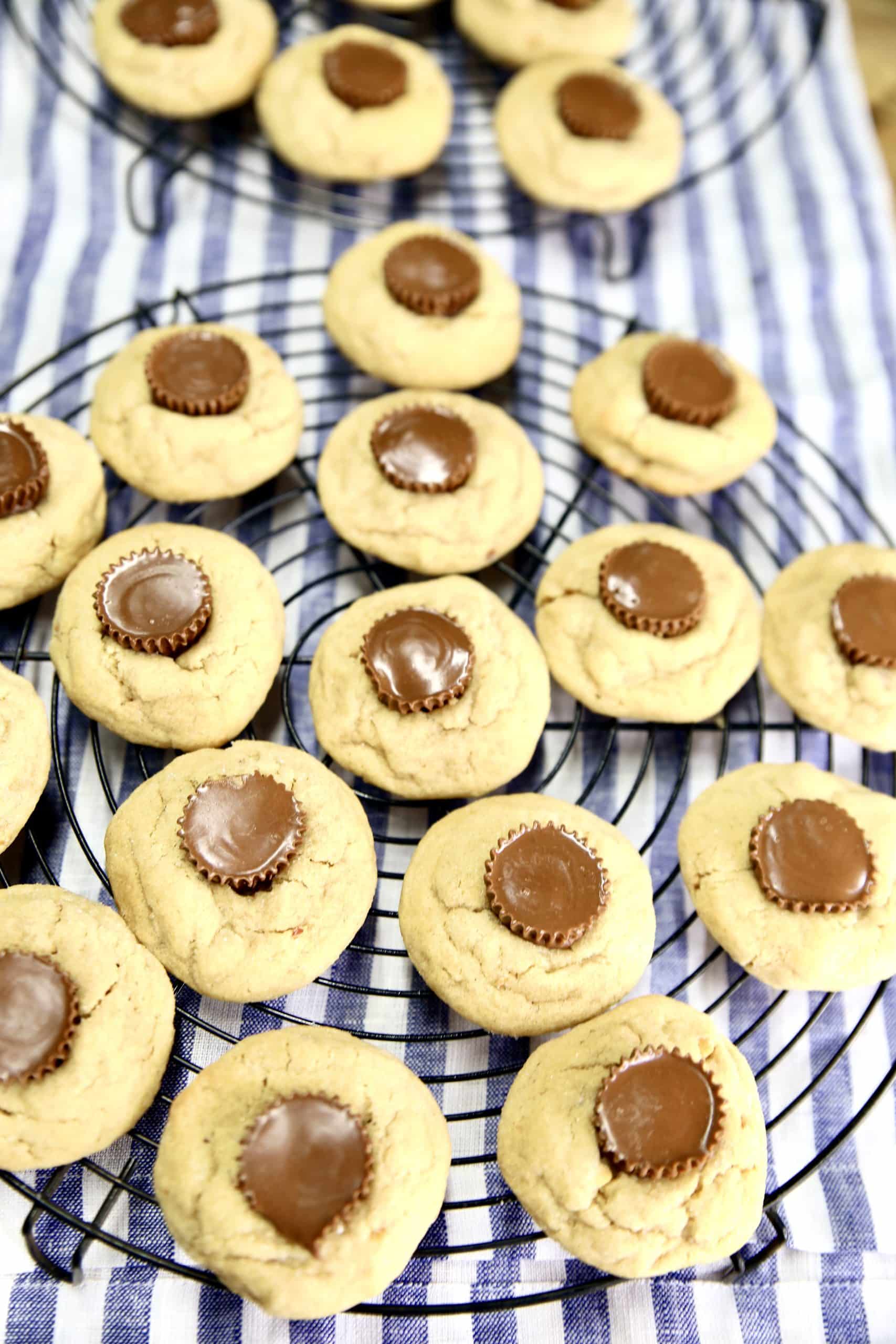 Peanut butter cup cookies on 2 round cooling racks.