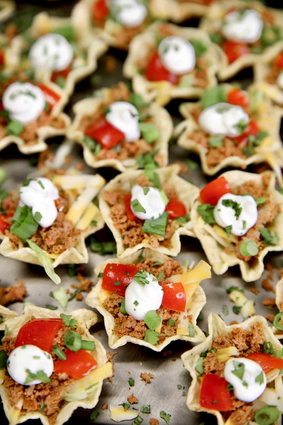 Taco Bites appetizers on a black platter.